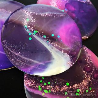 4 circular coasters - shades of purple and white with specks of glitter